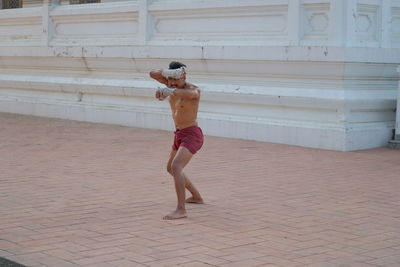 Shirtless man at temple