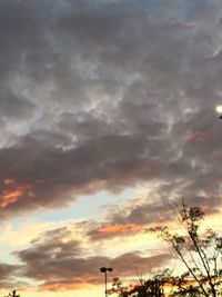 Low angle view of cloudy sky at sunset