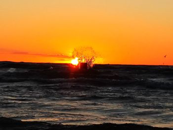 Scenic view of sea against sky during sunset