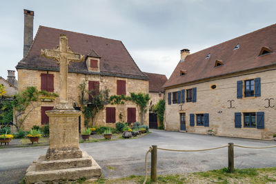 Exterior of historic building in town against sky