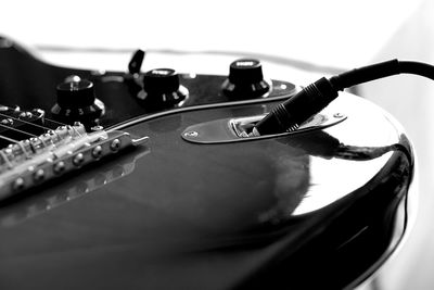 Close-up of guitar on table