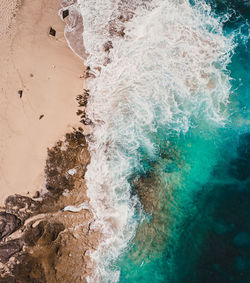 High angle view of surf on beach