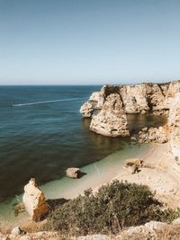 Ocean shades and rocks formations view while hiking in algarve, portugal 