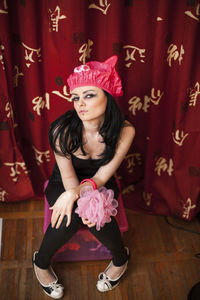 Portrait of young woman with bouquet