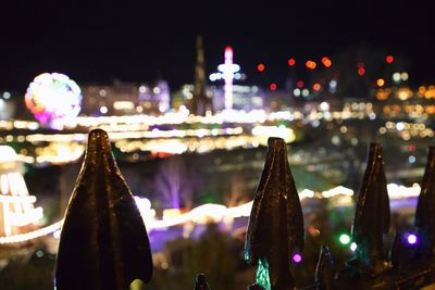 Close-up of illuminated lanterns hanging in city at night