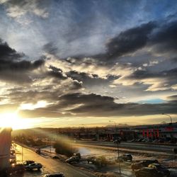 Road against cloudy sky at sunset