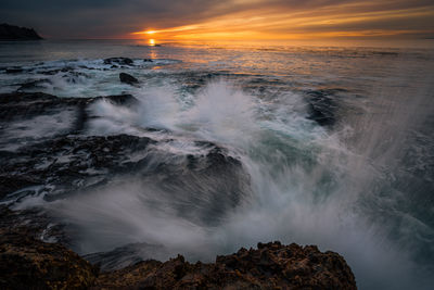 Scenic view of sea against sky during sunset