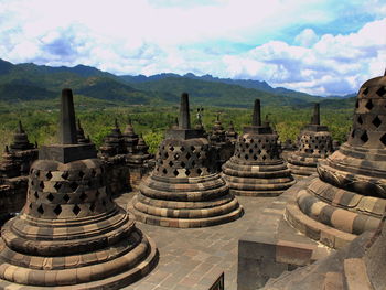 Temple against cloudy sky