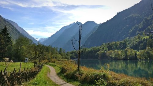 Scenic view of lake and mountains against sky