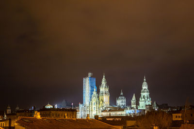 Illuminated buildings in city at night