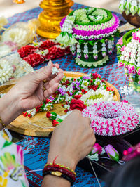 Midsection of woman holding flower bouquet