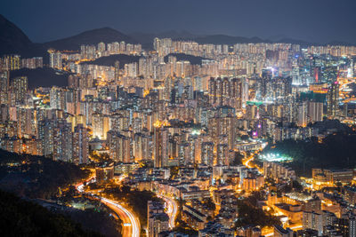 High angle view of city lit up at night