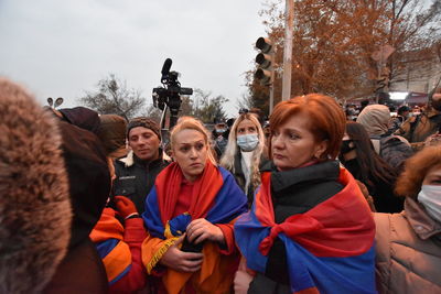 Portrait of people standing against sky