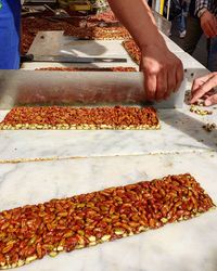 High angle view of man preparing food at market
