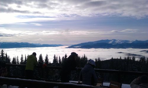 Scenic view of mountains against cloudy sky