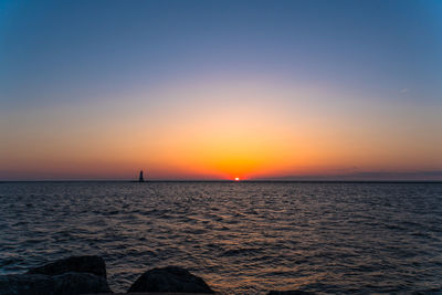 Scenic view of sea against sky during sunset