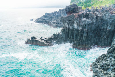 Scenic view of rocks in sea