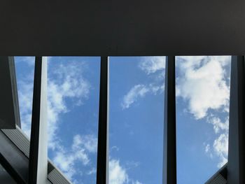 Low angle view of building seen through window