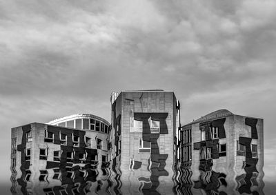 Low angle view of modern buildings against sky