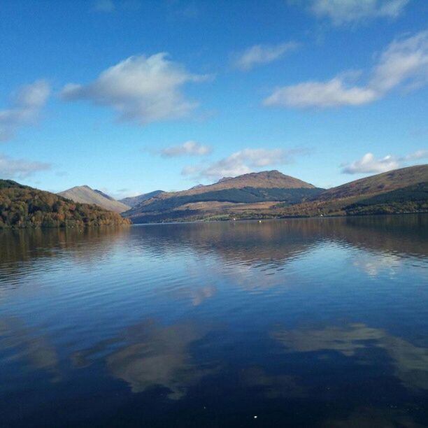 water, mountain, lake, tranquil scene, reflection, tranquility, scenics, sky, beauty in nature, waterfront, mountain range, blue, nature, cloud - sky, cloud, idyllic, calm, non-urban scene, day, river