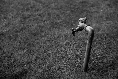 High angle view of water pipe on field