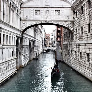 People on bridge over canal