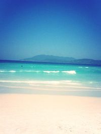 Scenic view of beach against clear sky