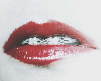 Close-up of red object over white background