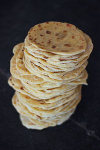 High angle view of bread on table against black background