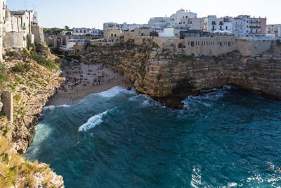 High angle view of sea by townscape