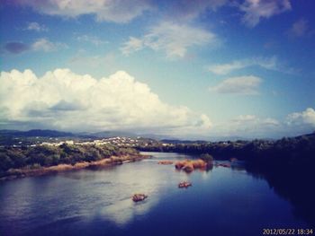 Scenic view of calm lake against blue sky