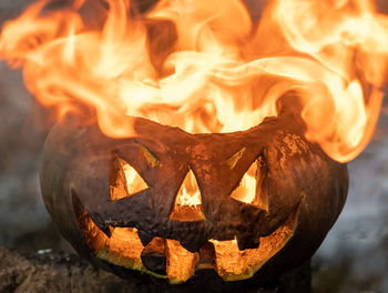 Close-up of pumpkin on bonfire