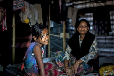 Girl sitting in traditional clothing