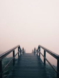 View of pier on bridge against clear sky