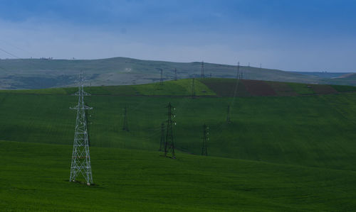 Scenic view of agricultural landscape against sky