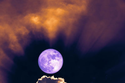 Low angle view of moon against sky at night