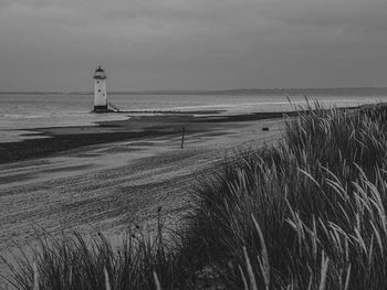 Point of ayr lighthouse talacre north wales with scenic view of beach and gasses on sand dunes