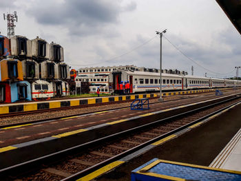 Train at railroad station against sky