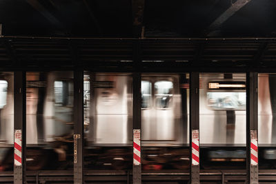 Blurred motion of train at railroad station