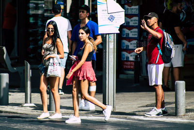 Full length of women standing in city