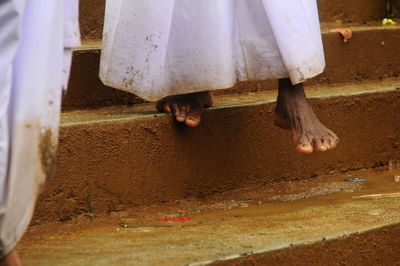 Low section of woman on steps