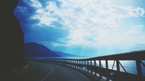 View of bridge against cloudy sky