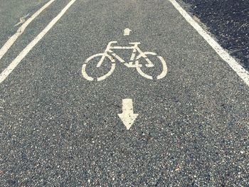 High angle view of arrow symbol on road