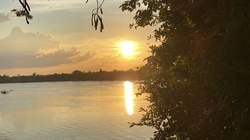 Scenic view of lake against sky during sunset