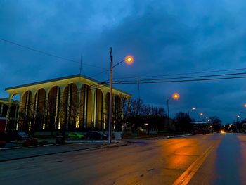 Street lights in city at dusk