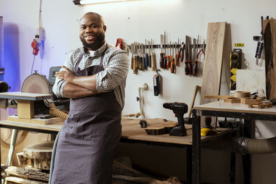 Side view of man working in workshop