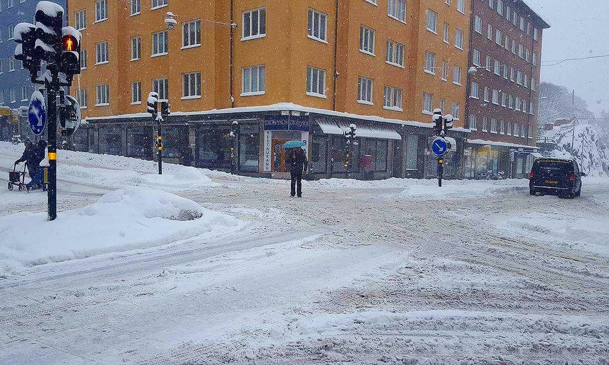 PERSON IN SNOW COVERED CITY