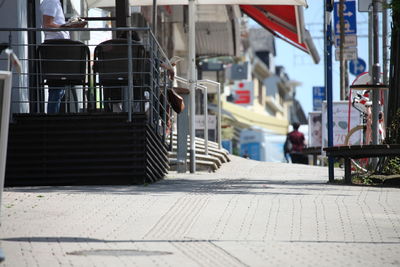 Footpath by street in city