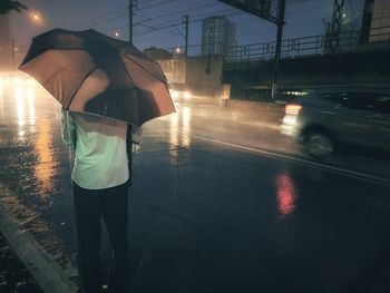 People walking on wet road