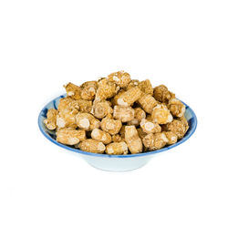 High angle view of bread in bowl against white background